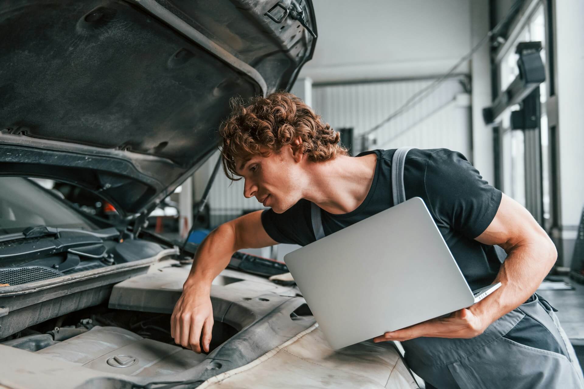 mechanic checking an engine
