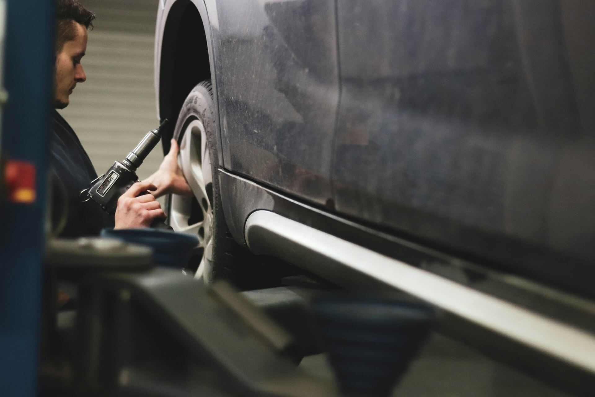 a mechanic inspecting a CPO vehicle
