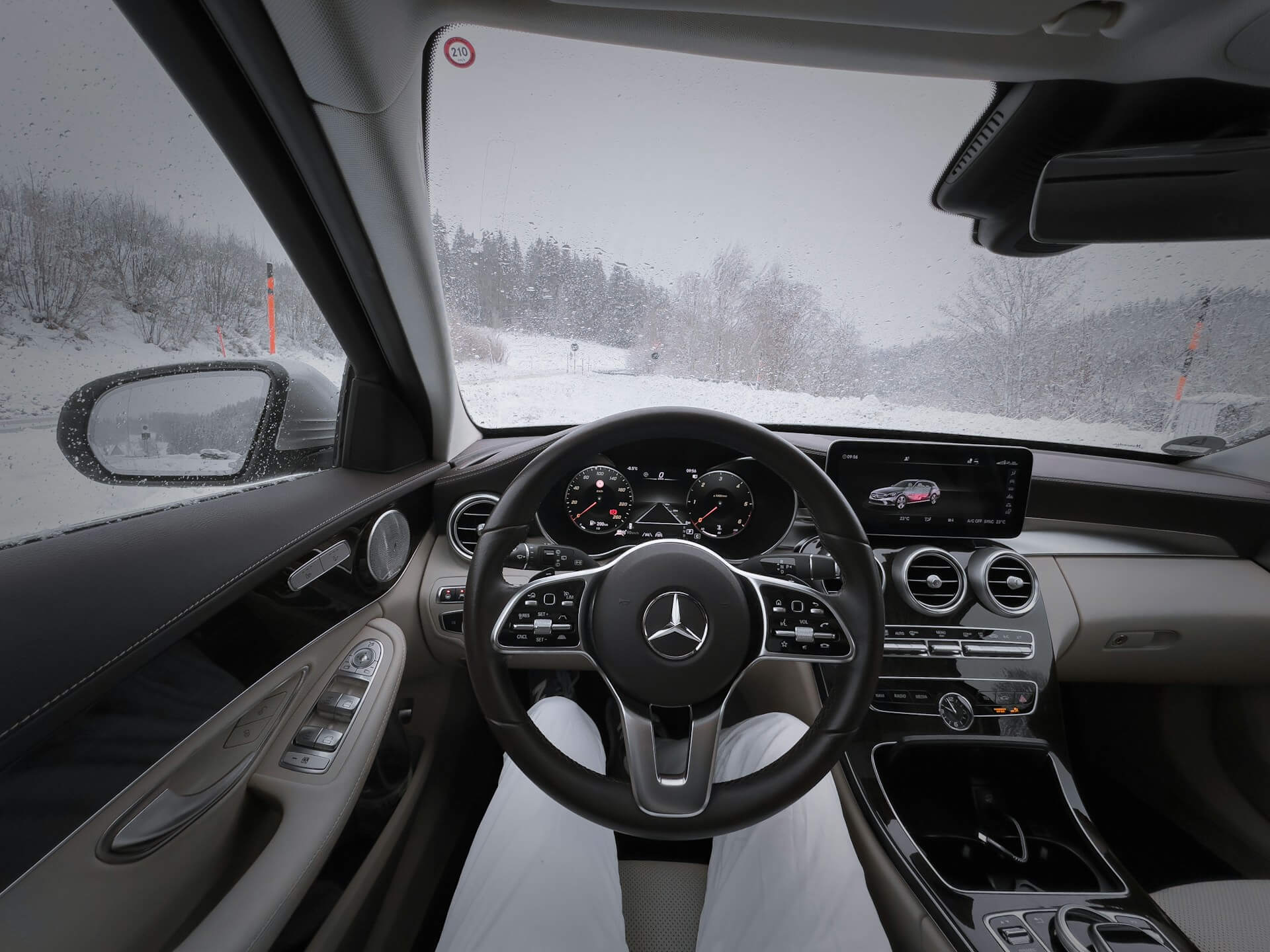 the view from the car window on a snowy road