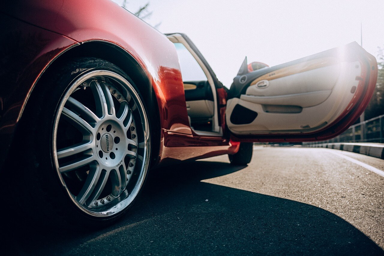 an open door of a red Lexus