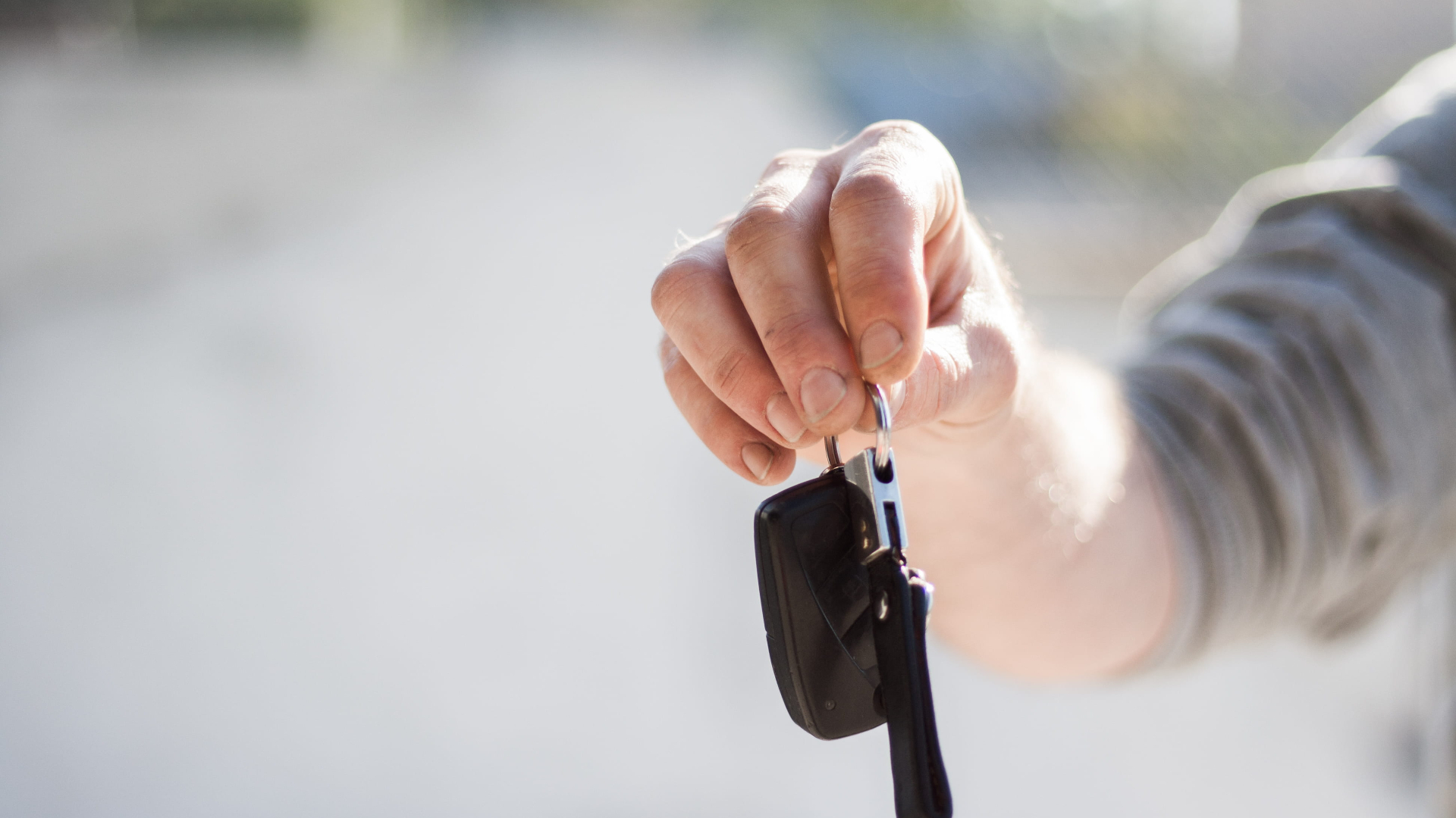 hand with car keys