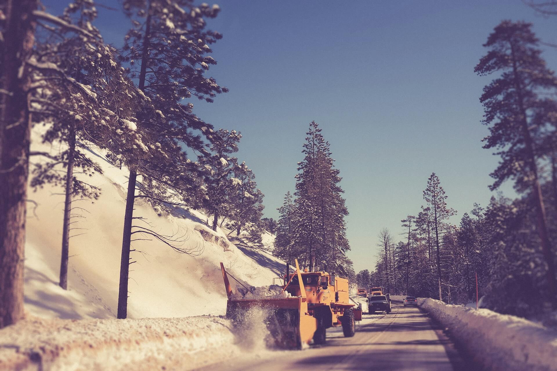 a specialized vehicle removes the snow from the road