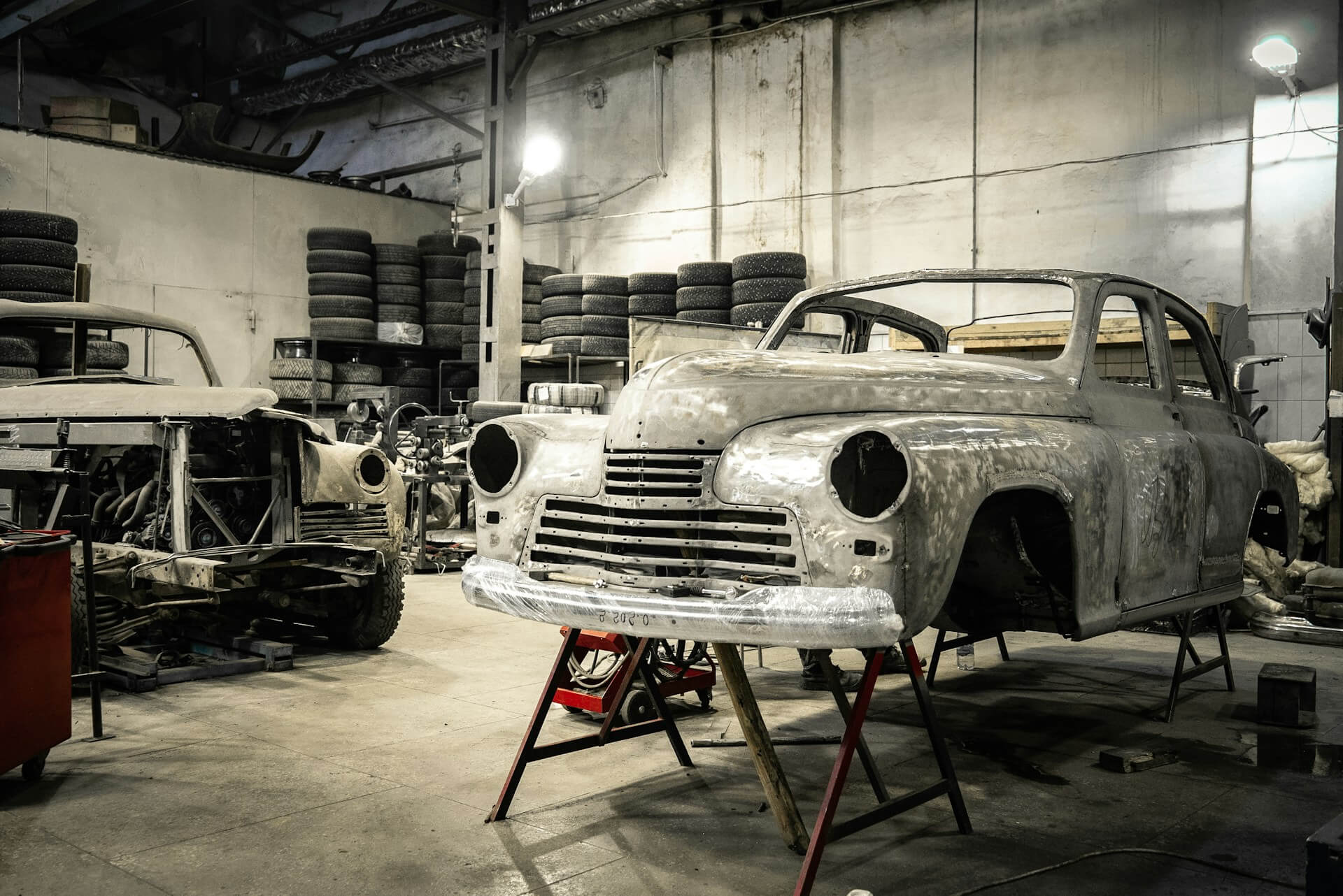 a vintage car painted in a repair shop