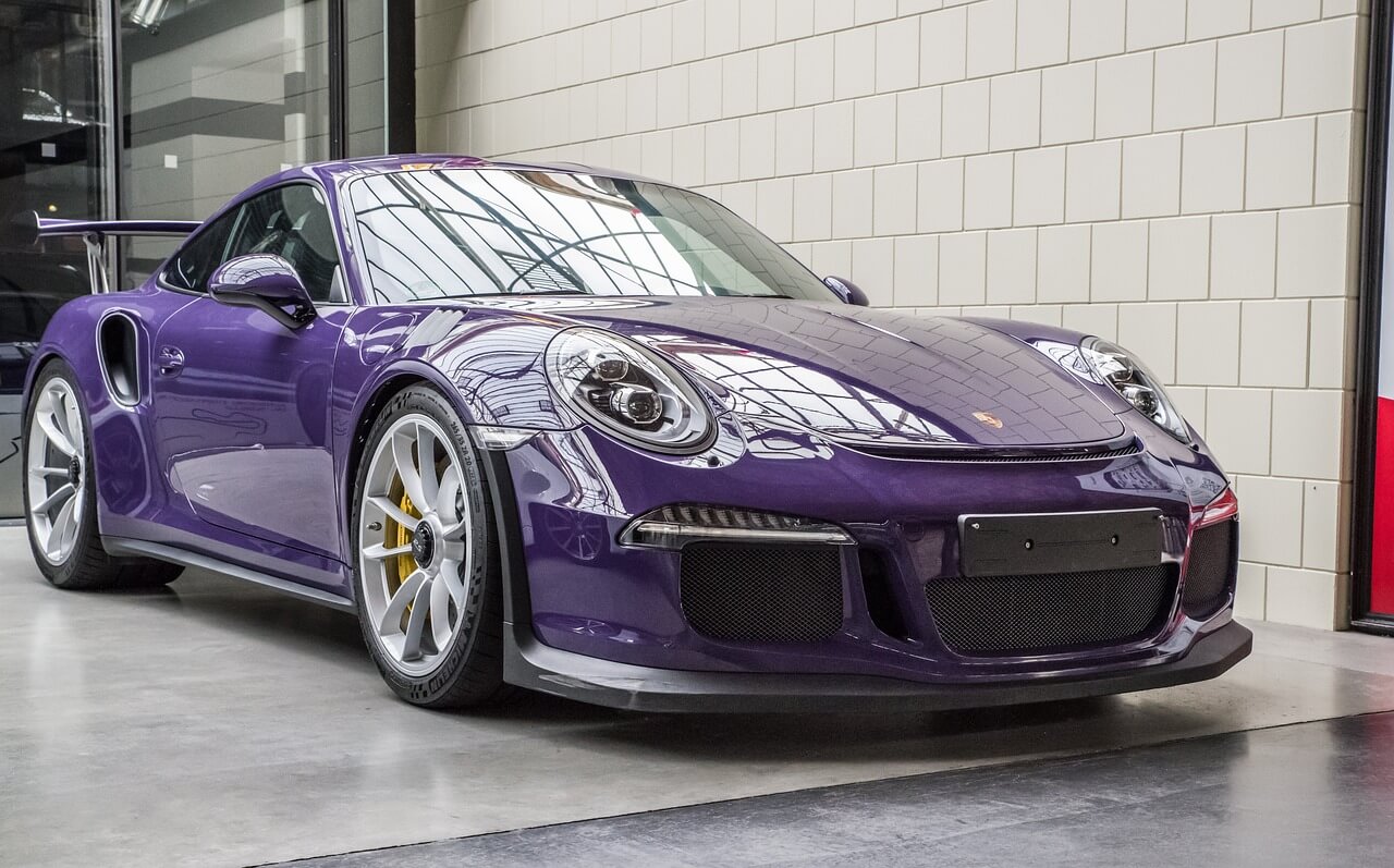 an expensive Porsche vehicle in a showroom