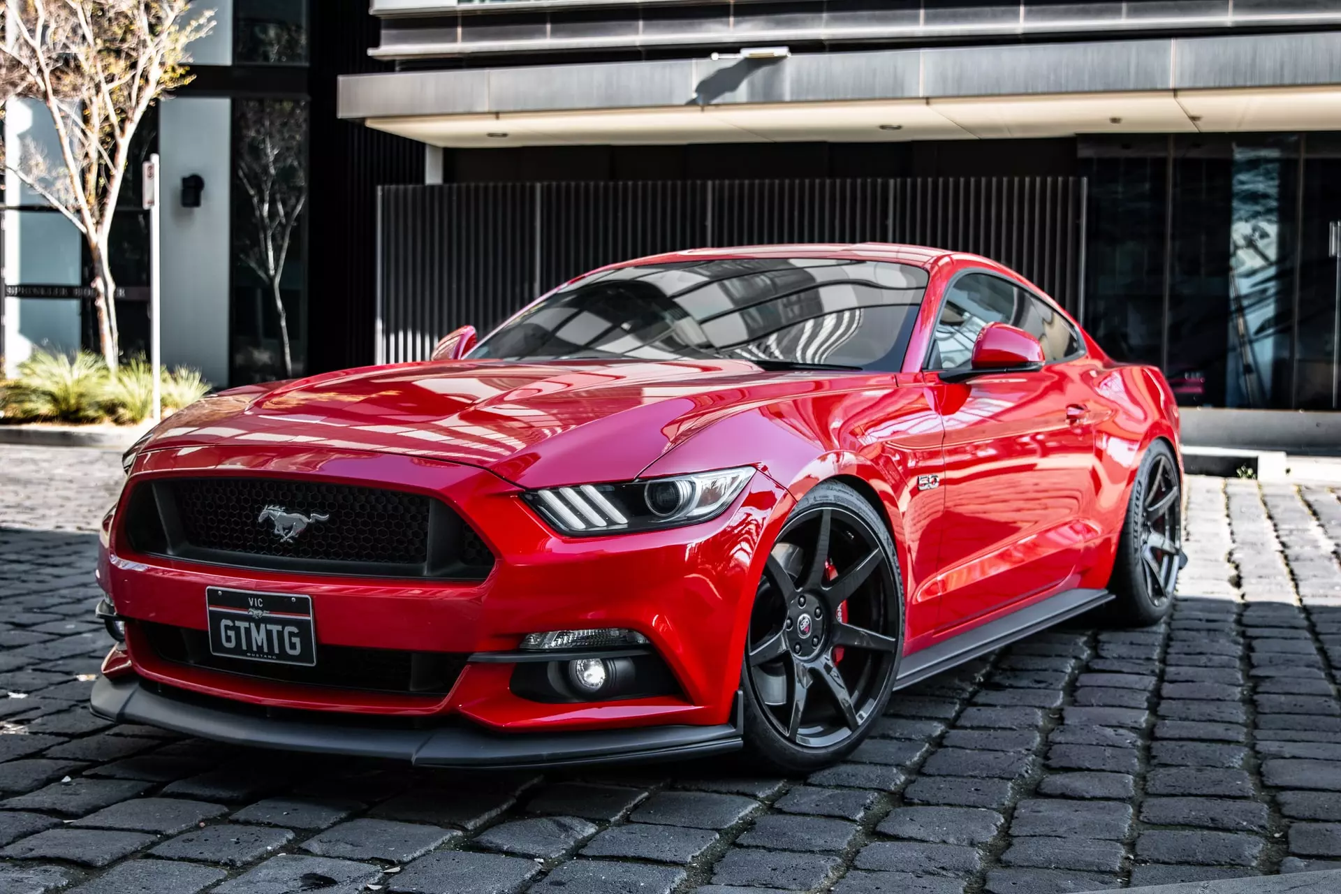 Red Mustang car on the street