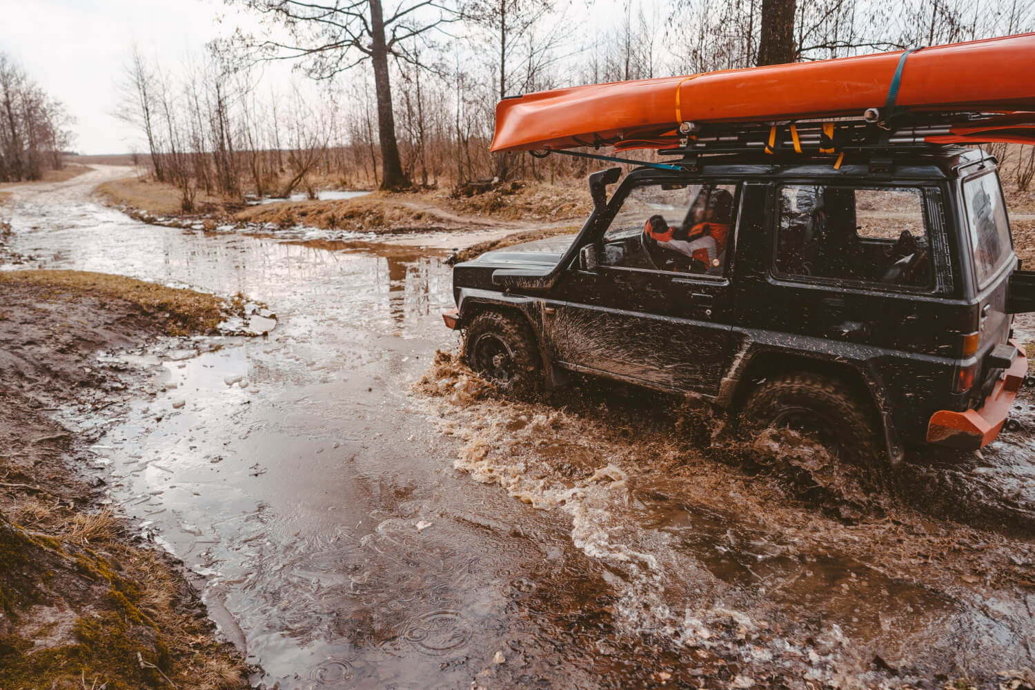 an off-road vehicle driving in the water