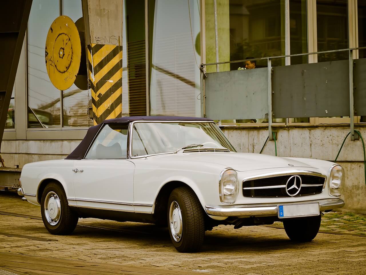 a vintage Mercedes Benz on the street