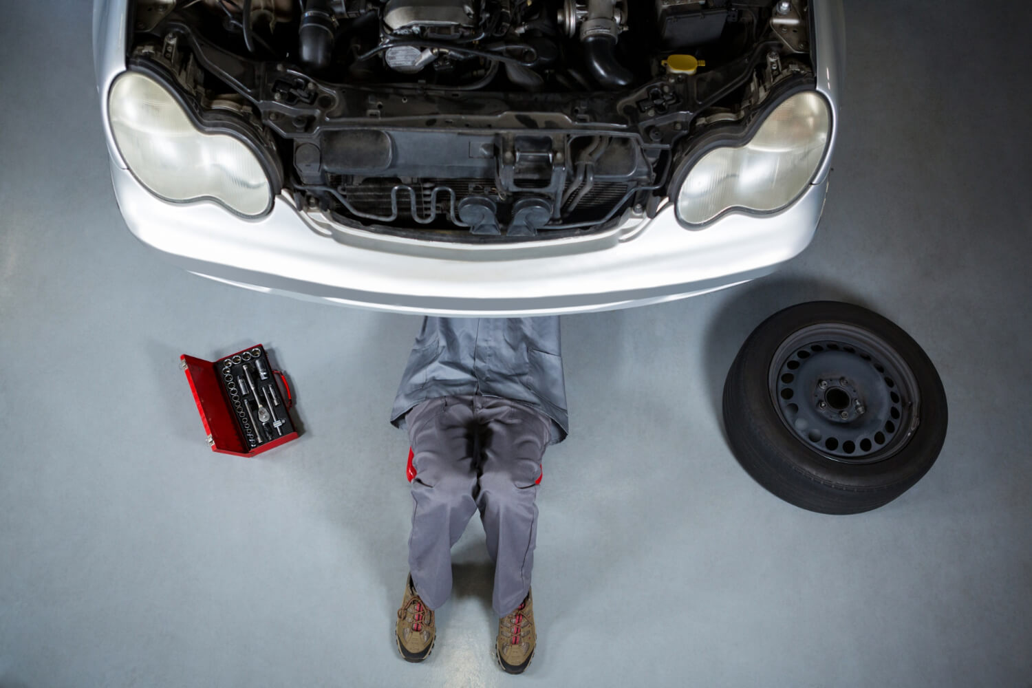 a mechanic repairing a car