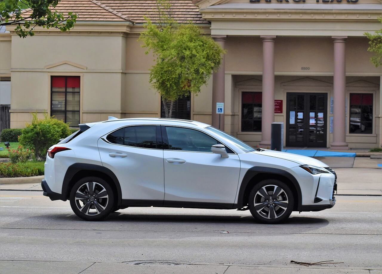 a Lexus parked near a bank